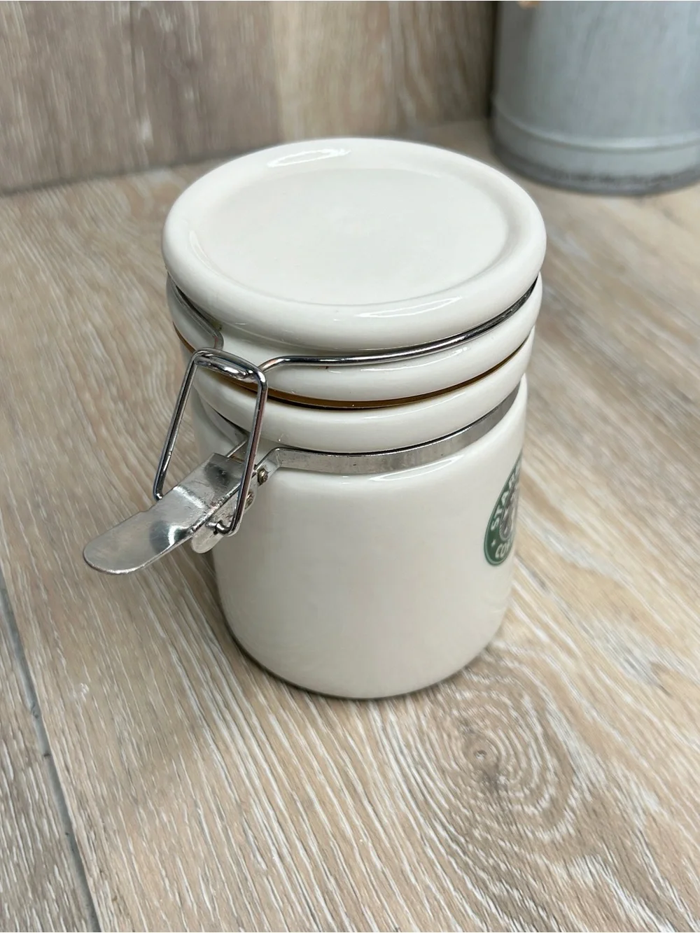 Starbucks White Ceramic Canister with Green Logo and Silver Clasp